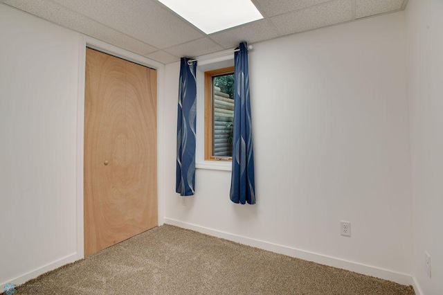 604 2nd Ave S, Kindred, ND 58052 - carpeted empty room with baseboards and a paneled ceiling
