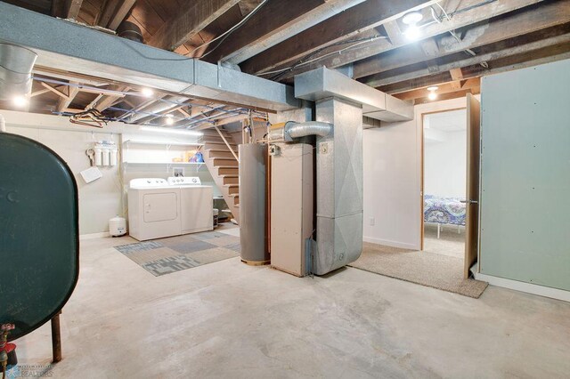604 2nd Ave S, Kindred, ND 58052 - unfinished below grade area with heating fuel, gas water heater, heating unit, washing machine and dryer, and stairs