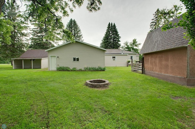 604 2nd Ave S, Kindred, ND 58052 - view of green lawn with an outdoor fire pit