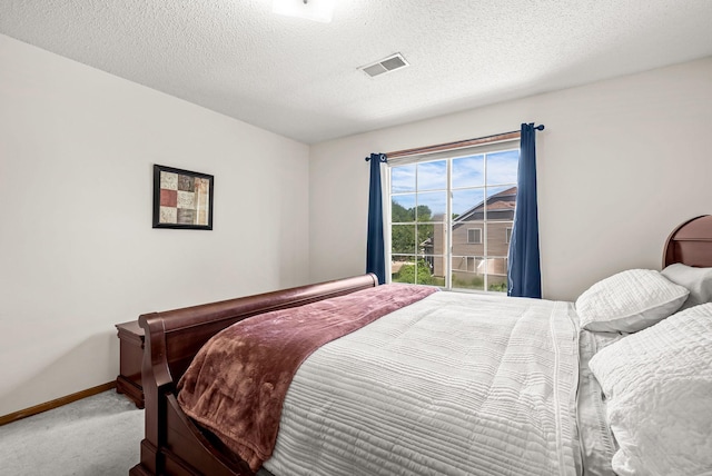 930 106th Ln NW Unit 9Nw, Coon Rapids, MN 55433 - carpeted bedroom featuring baseboards and a textured ceiling