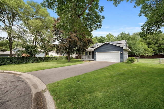 6722 116th Cir, Champlin, MN 55316 - view of front facade featuring roof mounted solar panels, a garage, and driveway