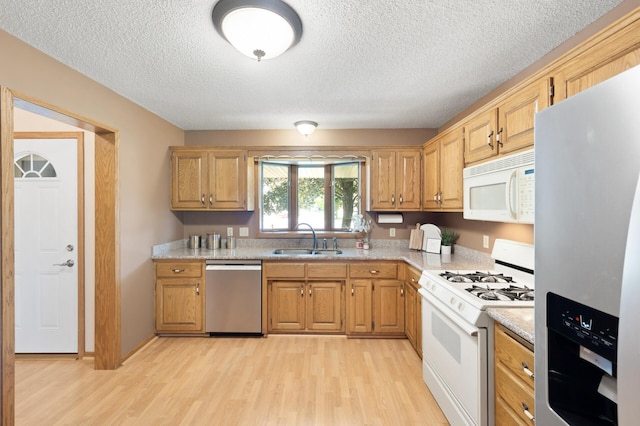 6722 116th Cir, Champlin, MN 55316 - kitchen with appliances with stainless steel finishes, light wood-style floors, and a textured ceiling