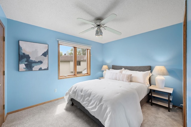 6722 116th Cir, Champlin, MN 55316 - bedroom featuring light carpet, a ceiling fan, and a textured ceiling