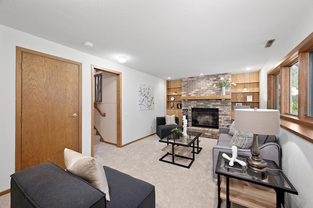 6722 116th Cir, Champlin, MN 55316 - living area with light carpet, stairs, a brick fireplace, and built in features