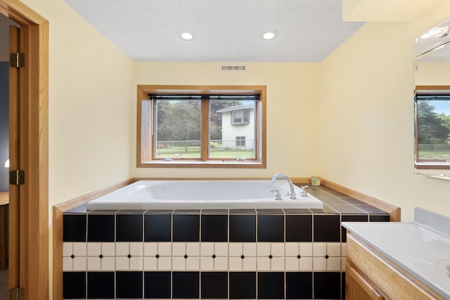 6722 116th Cir, Champlin, MN 55316 - bathroom featuring a garden tub, vanity, and recessed lighting
