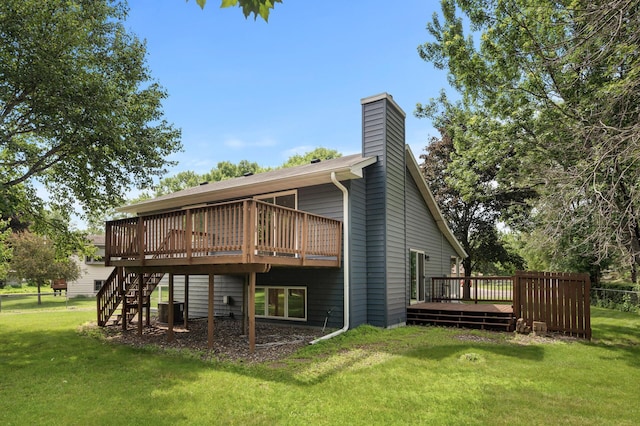 6722 116th Cir, Champlin, MN 55316 - rear view of house with a wooden deck, a lawn, a chimney, and stairway