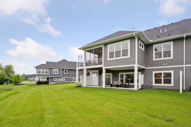 5975 Inland Ln N, Plymouth, MN 55446 - rear view of property with a patio, a balcony, a lawn, and an outdoor hangout area