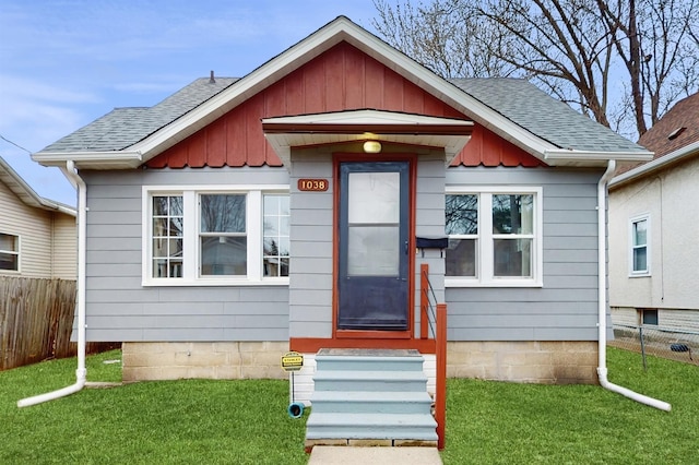 1038 23rd Ave SE, Minneapolis, MN 55414 - bungalow with board and batten siding, entry steps, and a shingled roof