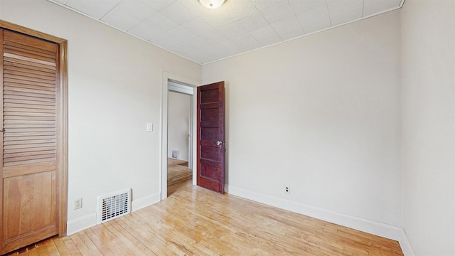 1038 23rd Ave SE, Minneapolis, MN 55414 - spare room featuring hardwood / wood-style floors and baseboards