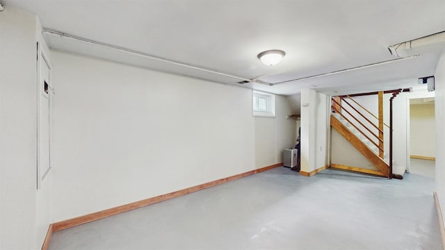 1038 23rd Ave SE, Minneapolis, MN 55414 - below grade area featuring stairway and baseboards