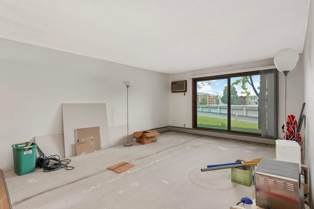 1903 Silver Bell Rd Unit 108, Eagan, MN 55122 - unfurnished room featuring an AC wall unit and a baseboard radiator