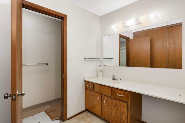 1903 Silver Bell Rd Unit 108, Eagan, MN 55122 - bathroom featuring vanity and baseboards