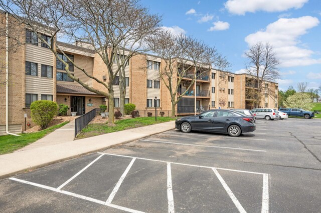 1903 Silver Bell Rd Unit 108, Eagan, MN 55122 - view of apartment building / complex featuring uncovered parking