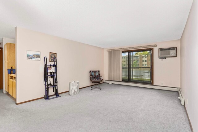 1887 Silver Bell Rd Unit 115, Eagan, MN 55122 - unfurnished room with an AC wall unit, light carpet, and baseboard heating