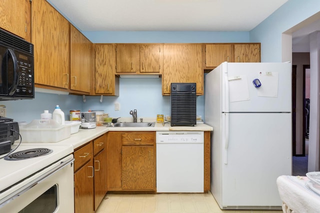 1887 Silver Bell Rd Unit 115, Eagan, MN 55122 - kitchen with white appliances, brown cabinetry, light countertops, and light floors