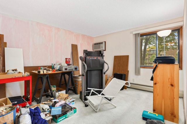 1887 Silver Bell Rd Unit 115, Eagan, MN 55122 - exercise area featuring a baseboard heating unit, a wall mounted air conditioner, and carpet