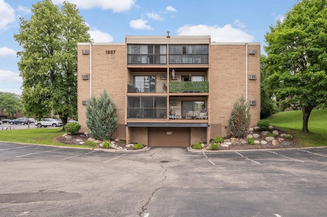 1887 Silver Bell Rd Unit 115, Eagan, MN 55122 - view of apartment building / complex with uncovered parking