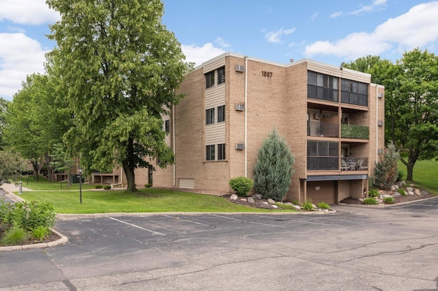 1887 Silver Bell Rd Unit 115, Eagan, MN 55122 - view of apartment building / complex featuring uncovered parking