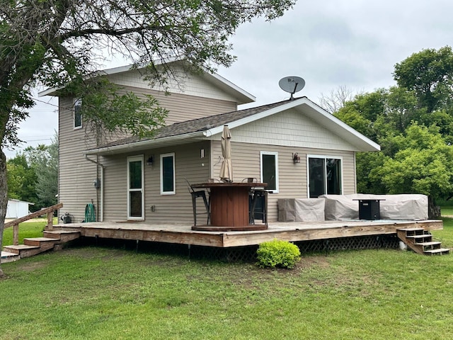 316 2nd St NE, Menahga, MN 56464 - back of property featuring a yard and a deck