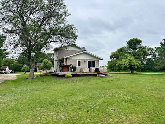316 2nd St NE, Menahga, MN 56464 - back of property featuring a yard and a deck
