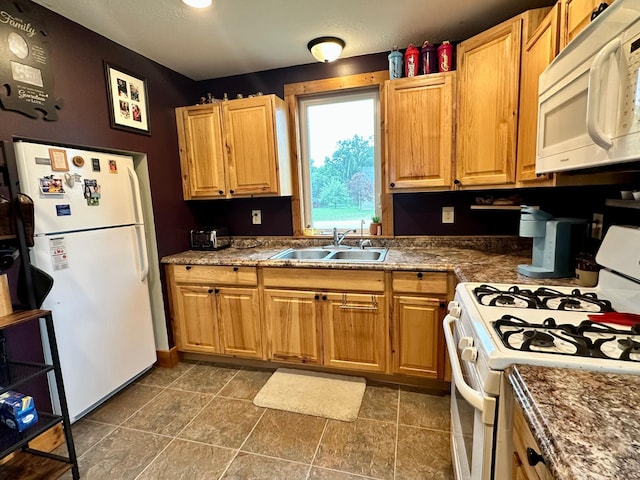 316 2nd St NE, Menahga, MN 56464 - kitchen with white appliances and dark countertops