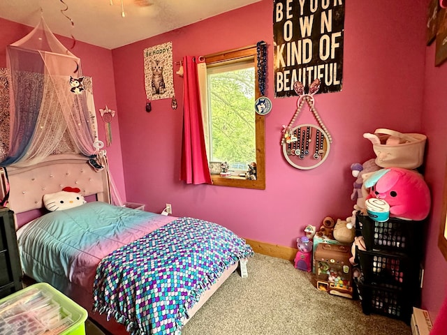 316 2nd St NE, Menahga, MN 56464 - bedroom featuring carpet floors and a baseboard radiator