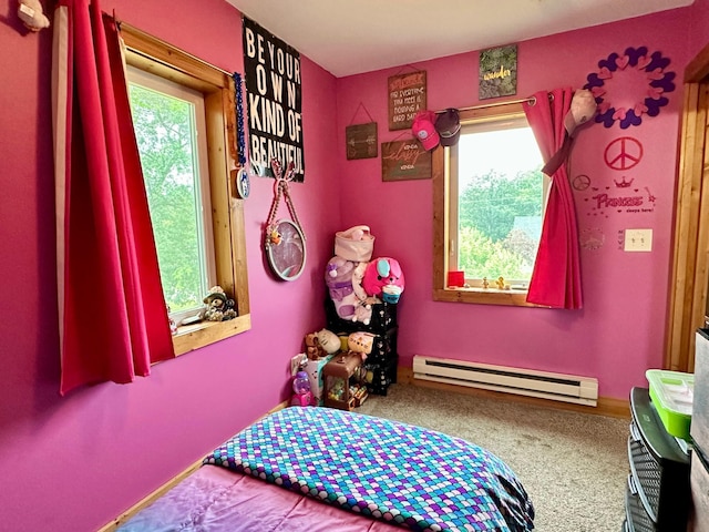 316 2nd St NE, Menahga, MN 56464 - carpeted bedroom featuring a baseboard radiator and multiple windows