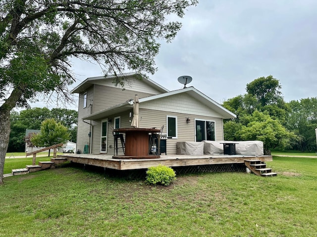 316 2nd St NE, Menahga, MN 56464 - rear view of property featuring a yard and a deck