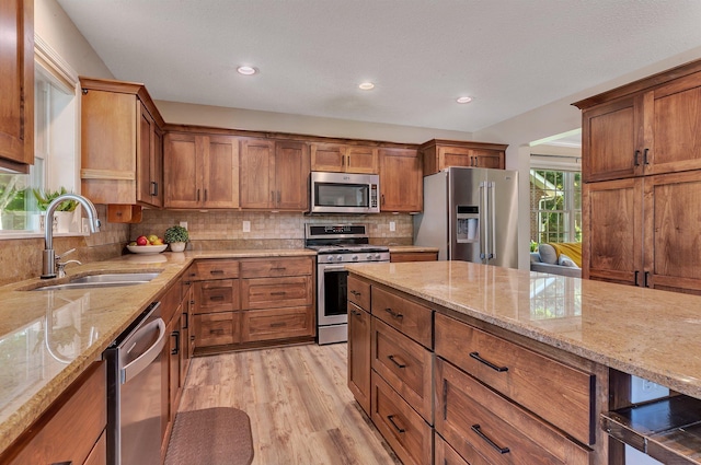 2668 Waterford Ct, Saint Cloud, MN 56301 - kitchen featuring stainless steel appliances, light wood-style flooring, brown cabinets, and recessed lighting