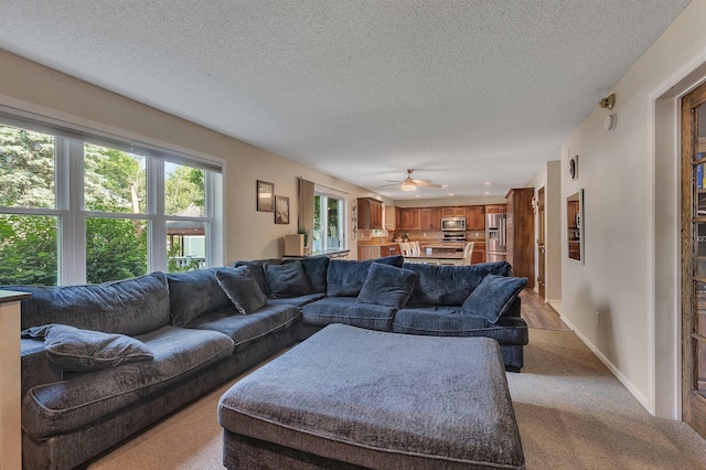 2668 Waterford Ct, Saint Cloud, MN 56301 - living room with a textured ceiling, carpet flooring, and ceiling fan
