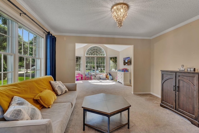 2668 Waterford Ct, Saint Cloud, MN 56301 - living area featuring crown molding, light colored carpet, a textured ceiling, and a chandelier