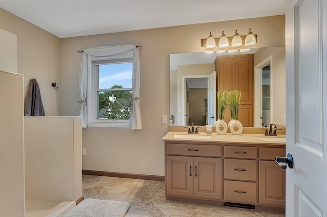 2668 Waterford Ct, Saint Cloud, MN 56301 - bathroom featuring double vanity and baseboards