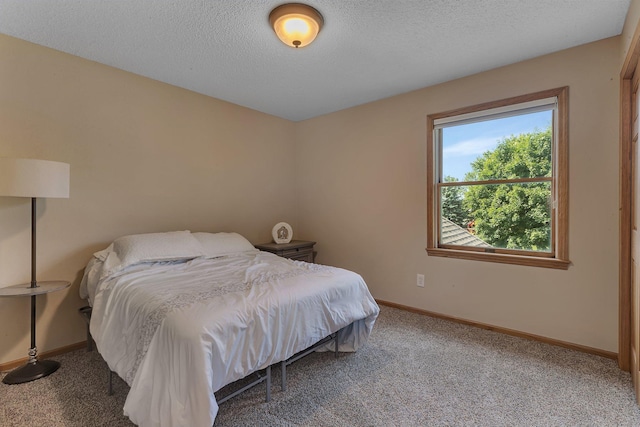 2668 Waterford Ct, Saint Cloud, MN 56301 - carpeted bedroom with baseboards and a textured ceiling