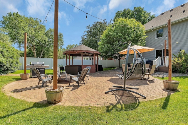 2668 Waterford Ct, Saint Cloud, MN 56301 - fenced backyard featuring a hot tub, a gazebo, a patio, and a grill