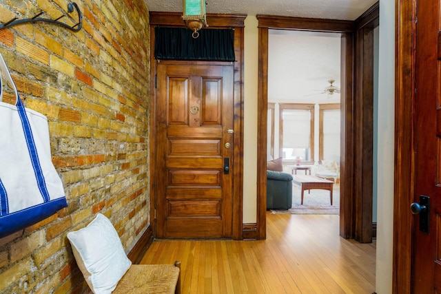 63 Avon St S Unit 36, Saint Paul, MN 55105 - hall featuring brick wall and light wood-type flooring
