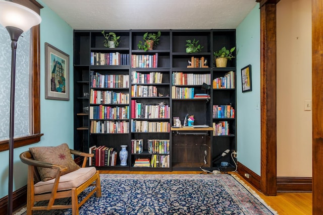 63 Avon St S Unit 36, Saint Paul, MN 55105 - living area with wood finished floors and a textured ceiling