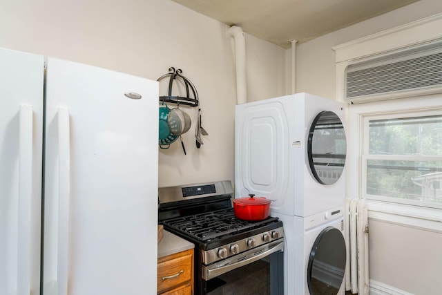 63 Avon St S Unit 36, Saint Paul, MN 55105 - laundry room featuring stacked washer and clothes dryer and a wall mounted air conditioner