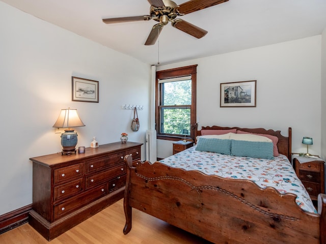 63 Avon St S Unit 36, Saint Paul, MN 55105 - bedroom with light wood finished floors, radiator, and a ceiling fan