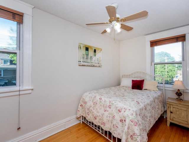 63 Avon St S Unit 36, Saint Paul, MN 55105 - bedroom featuring light wood-type flooring and a ceiling fan