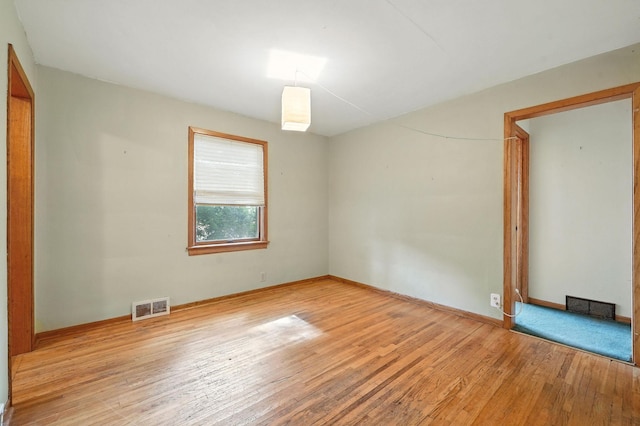 6398 Osman Ave N, Oak Park Heights, MN 55082 - empty room with hardwood / wood-style floors and baseboards
