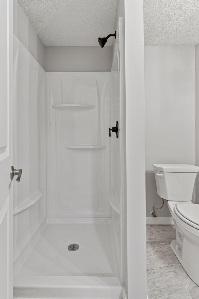 8072 Jocelyn Ave S, Cottage Grove, MN 55016 - bathroom featuring a textured ceiling and a shower stall