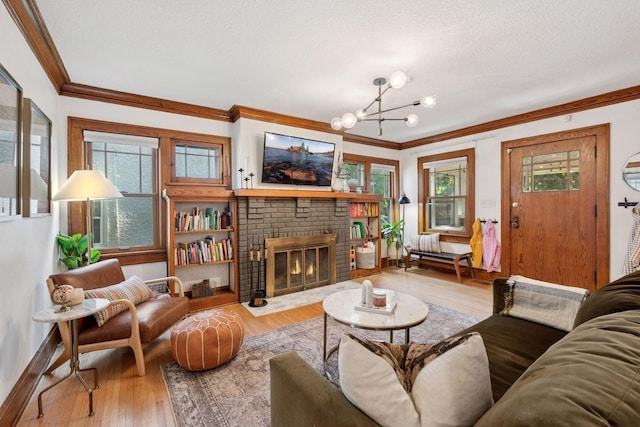 4708 Pleasant Ave, Minneapolis, MN 55419 - living room featuring ornamental molding, a chandelier, wood finished floors, healthy amount of natural light, and a textured ceiling