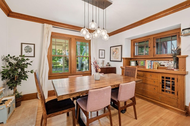 4708 Pleasant Ave, Minneapolis, MN 55419 - dining space with light wood finished floors, crown molding, and a chandelier
