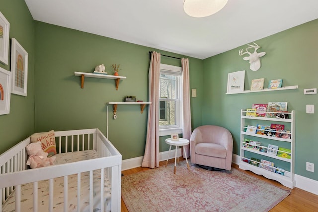 4708 Pleasant Ave, Minneapolis, MN 55419 - bedroom with a crib and wood finished floors