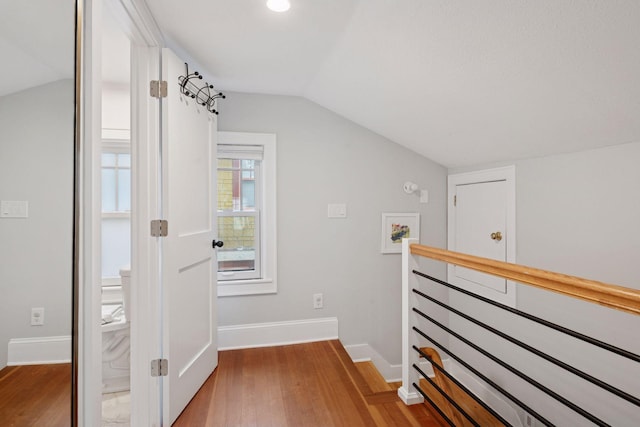 4708 Pleasant Ave, Minneapolis, MN 55419 - hall with vaulted ceiling, wood finished floors, and an upstairs landing