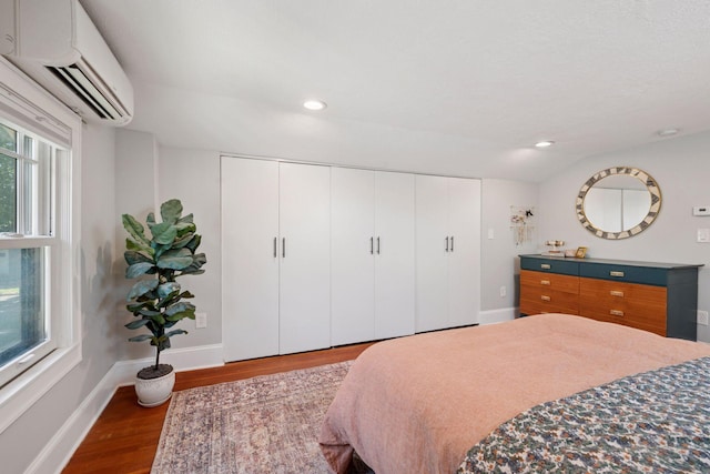 4708 Pleasant Ave, Minneapolis, MN 55419 - bedroom featuring a wall unit AC, wood finished floors, recessed lighting, and a closet