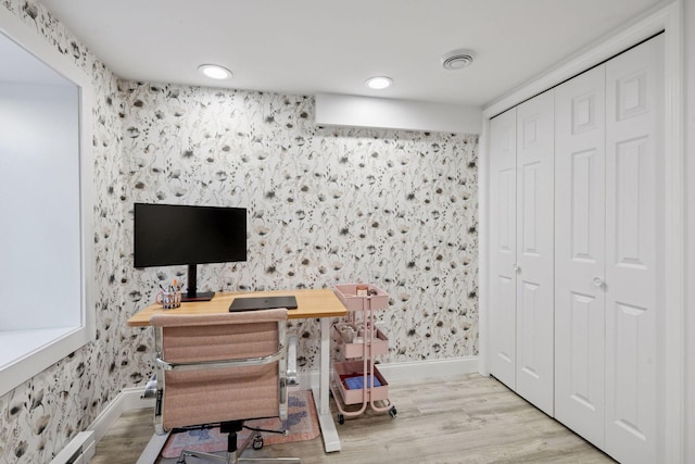 4708 Pleasant Ave, Minneapolis, MN 55419 - office area with wallpapered walls, wood finished floors, and a baseboard heating unit