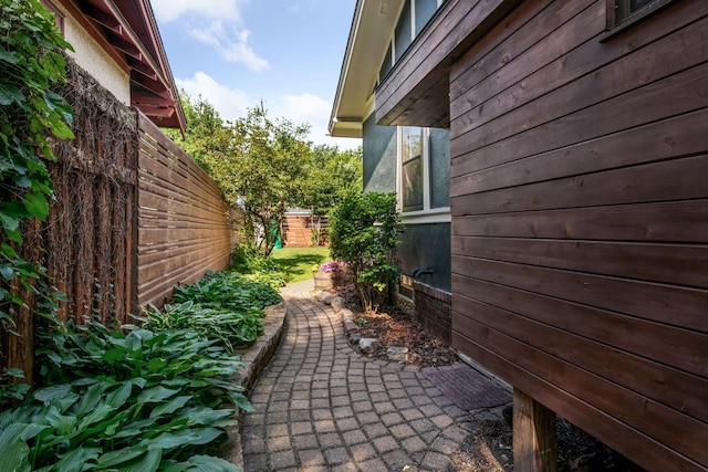 4708 Pleasant Ave, Minneapolis, MN 55419 - view of side of home featuring a storage unit and a patio