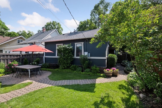4708 Pleasant Ave, Minneapolis, MN 55419 - rear view of property with a patio area, stucco siding, and a shingled roof