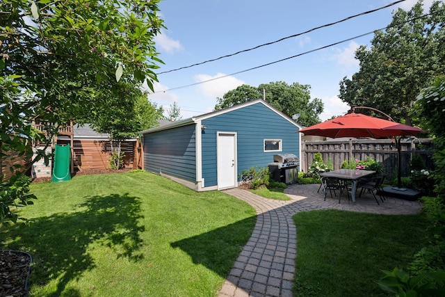 4708 Pleasant Ave, Minneapolis, MN 55419 - view of yard with a patio, an outdoor structure, and a playground
